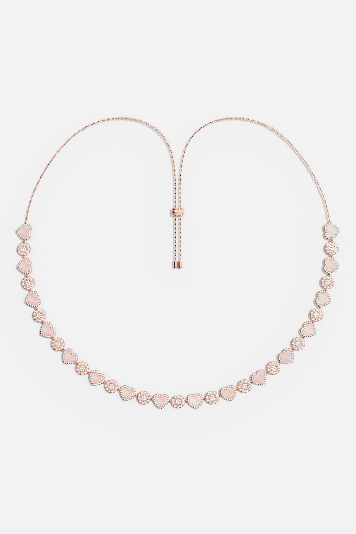 APM Necklace in rose rhodium finish, a tender cascade of hearts and sparkle.