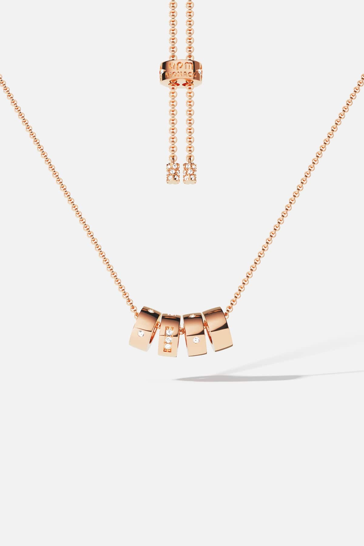 APM Necklace in rose color, sliding charms and quiet sparkle, effortlessly modern.
