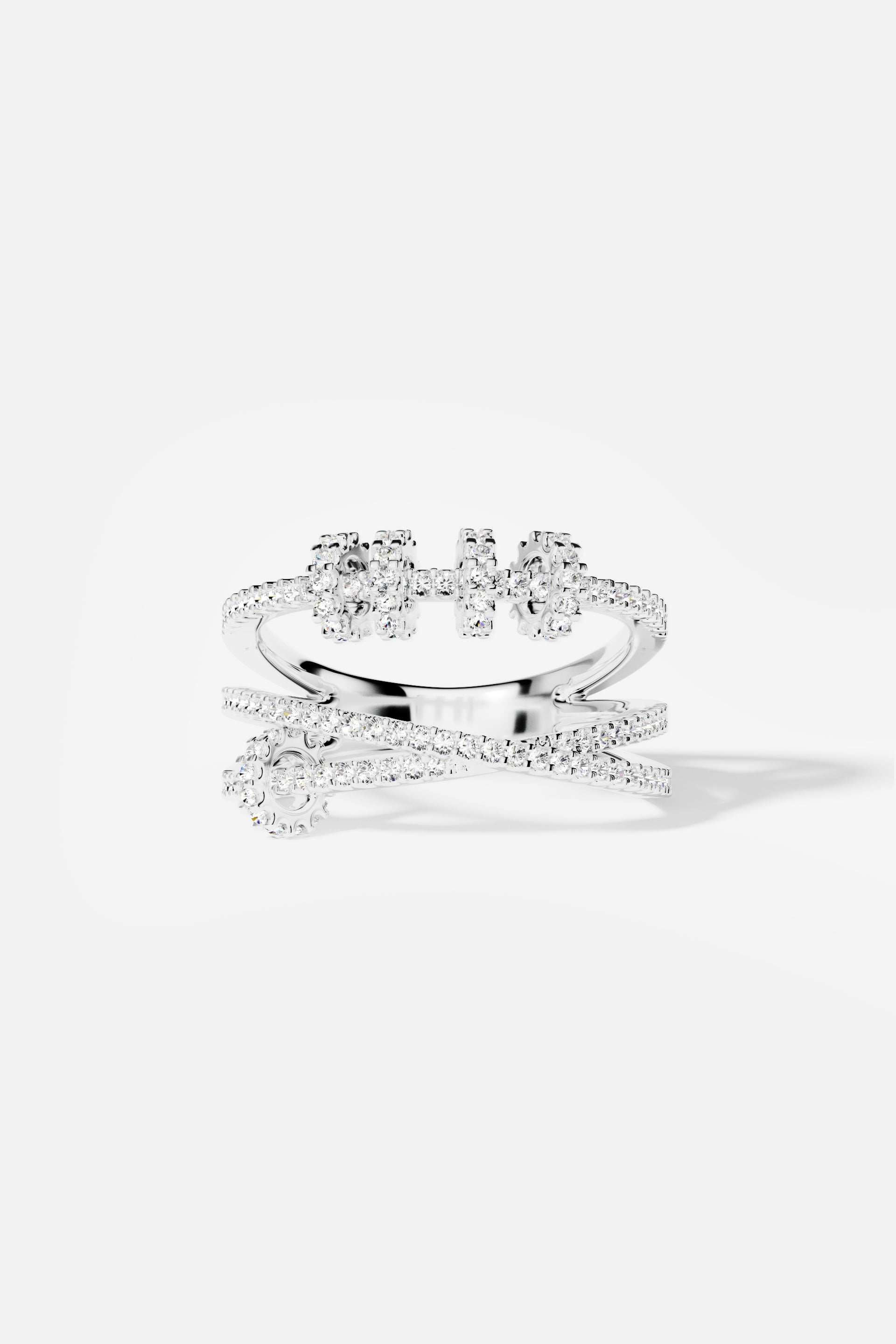 APM Ring, sparkling crossover lines in rhodium finish, effortlessly modern elegance.