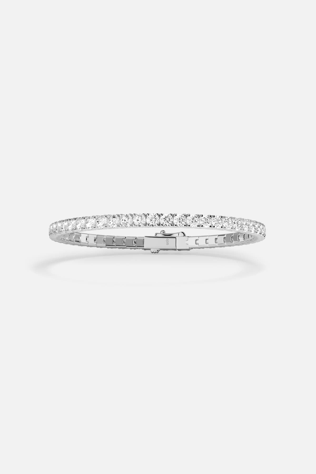 APM tennis bracelet in rhodium finish, a timeless sparkle for effortless elegance.