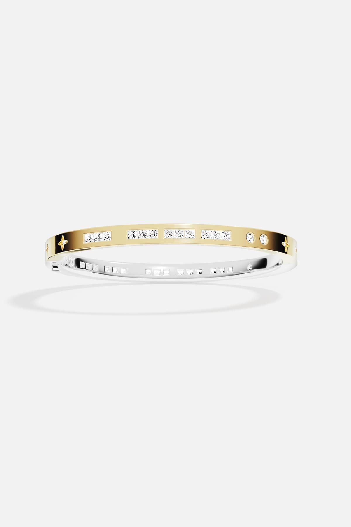 APM Monaco bangle in gold color, a modern shine with a celestial whisper.