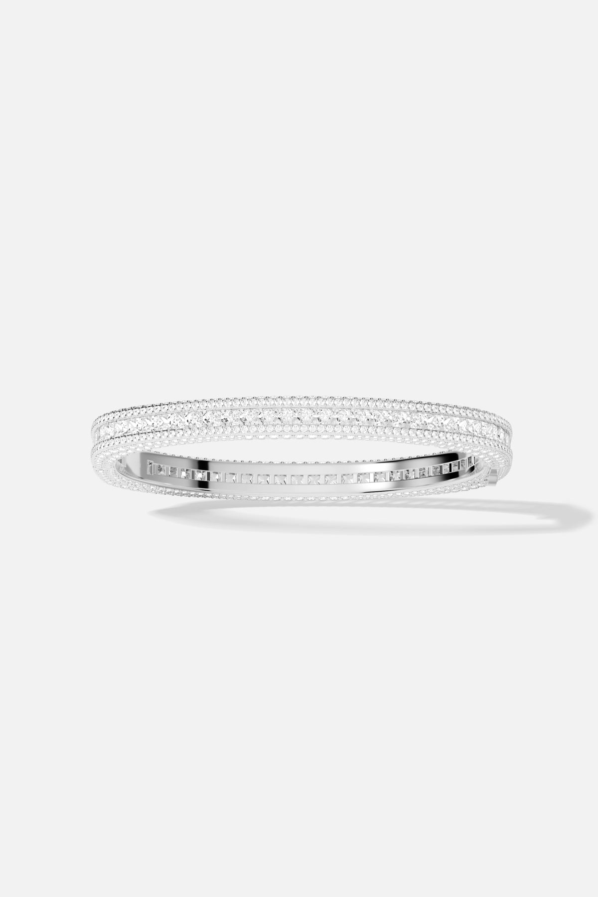 APM Bangle in rhodium finish, radiant brilliance wrapped around the wrist with quiet confidence.