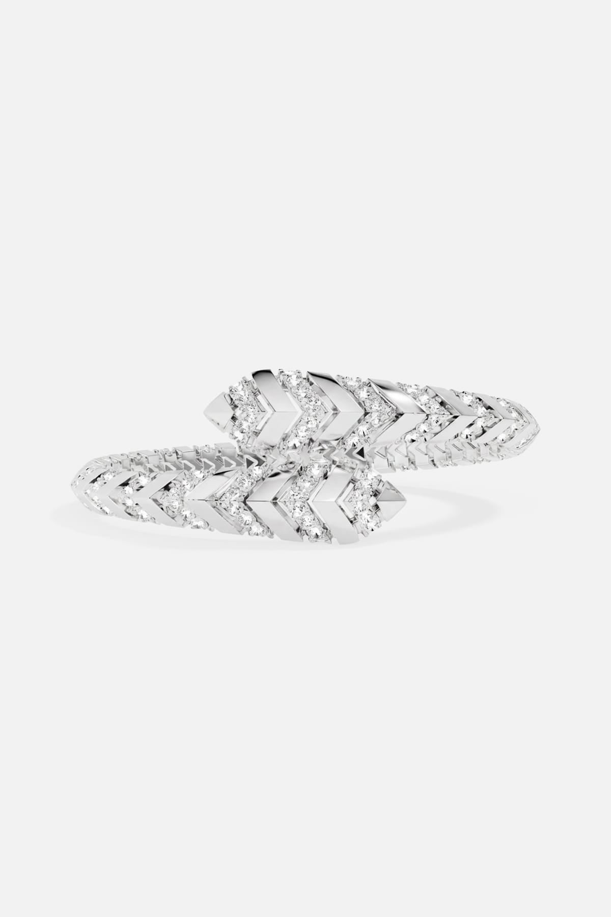 APM Monaco bracelet, a sleek chevron wrap glimmering with modern edge.