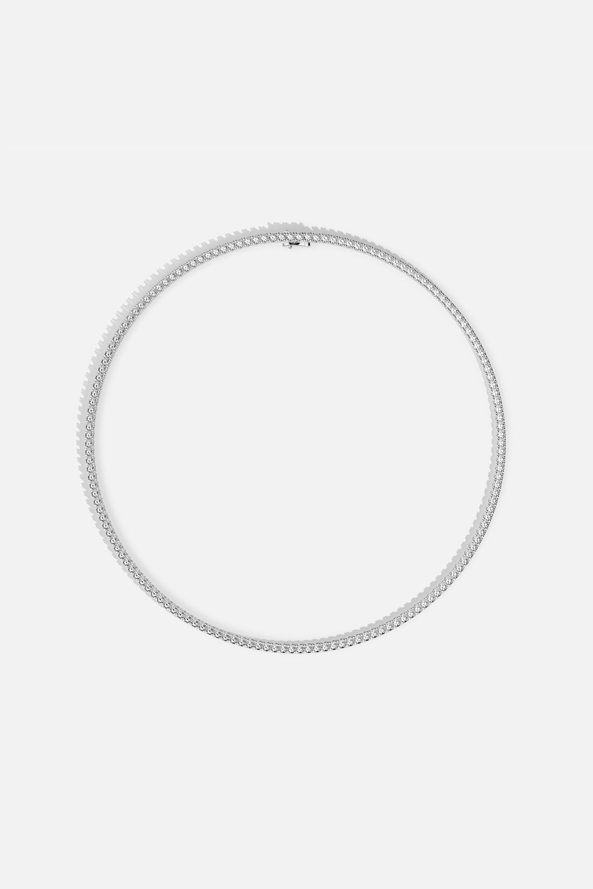 APM Tennis Necklace, a radiant line of brilliance in rhodium finish.