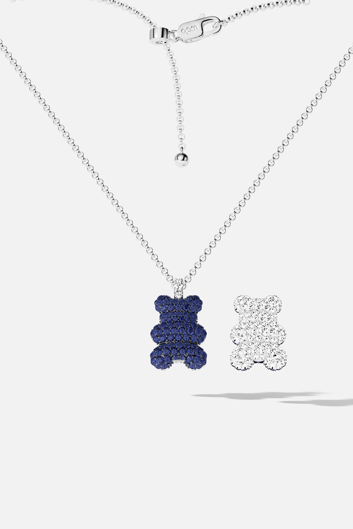 APM Bear Necklace, playful charm in deep blue and sparkling white.