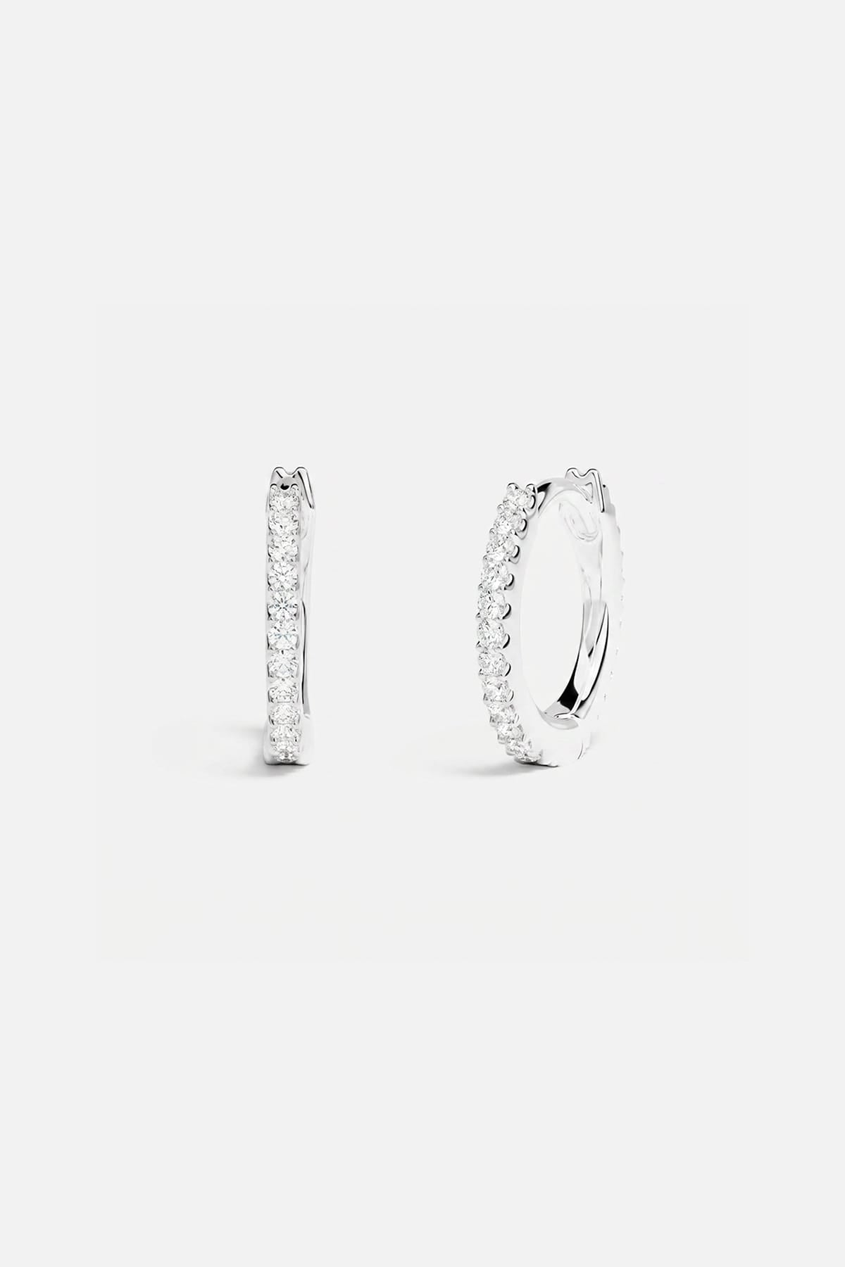 APM Hoop Earrings in rhodium finish, a delicate sparkle for effortless everyday elegance.