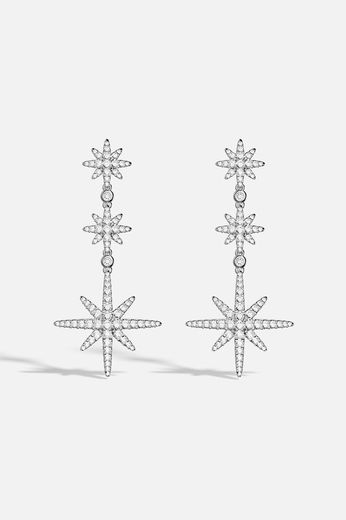 APM Météorites Earrings, a cascade of stars glowing with celestial charm.