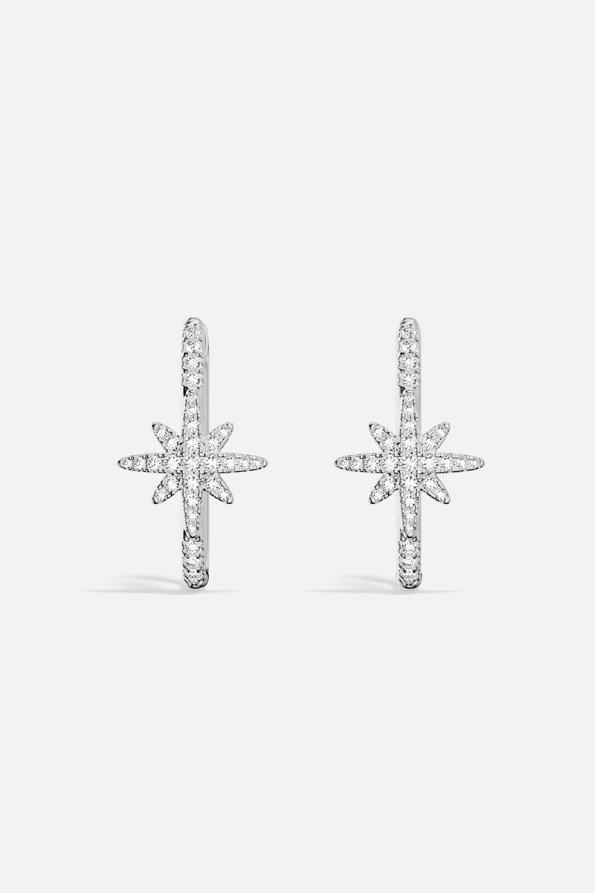 APM Météorites Earrings, a celestial sparkle in rhodium finish, effortlessly luminous.