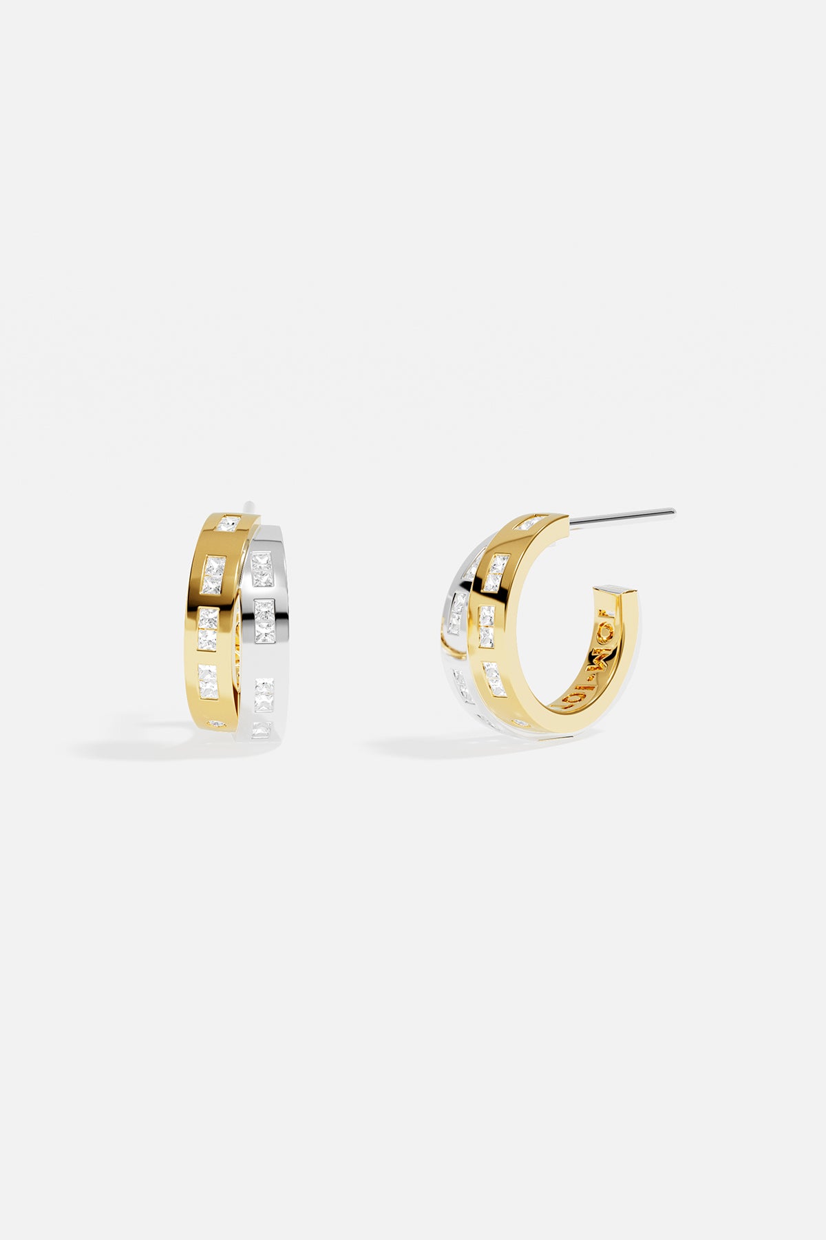APM Hoop Earrings in two-tone colors, a modern rhythm of light and elegance.