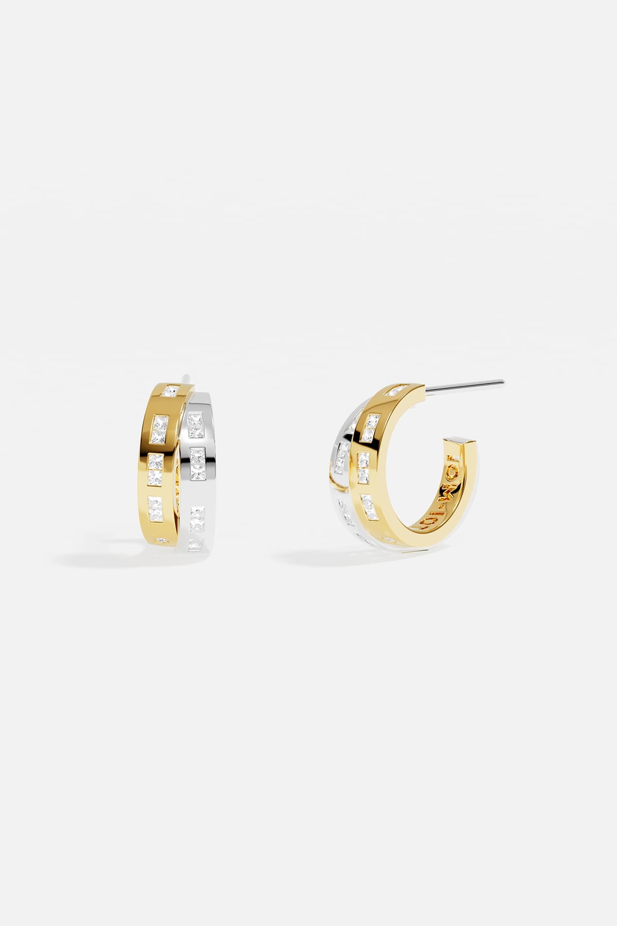 APM Hoop Earrings in two-tone colors, a modern rhythm of light and elegance.