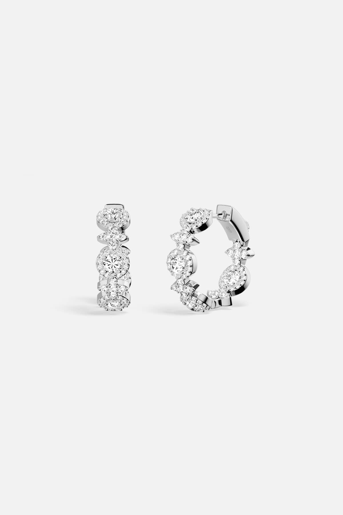 APM Hoop Earrings in rhodium finish, a radiant whisper of everyday elegance.