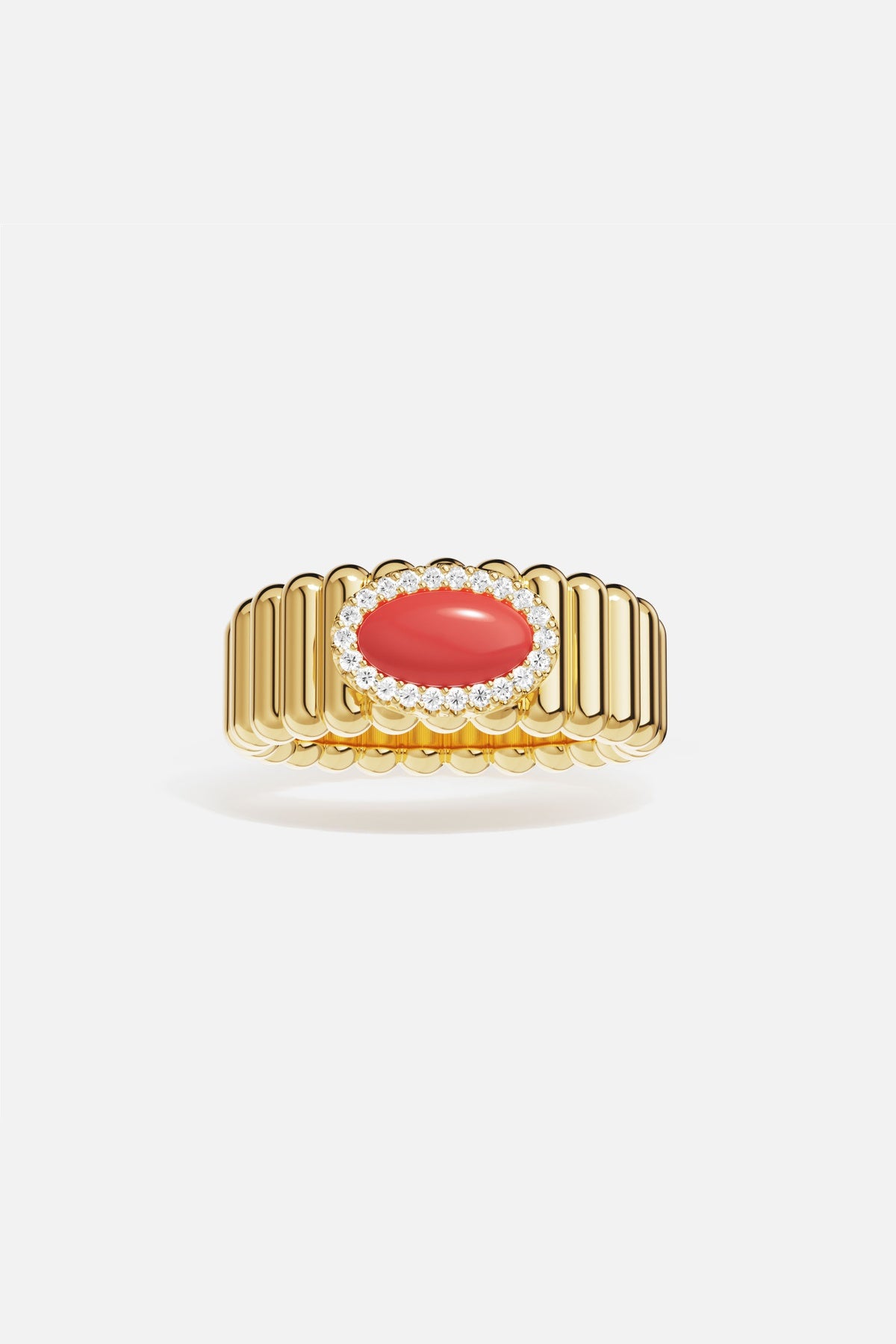 APM Ring in golden hue, a coral glow framed in radiant sparkle.