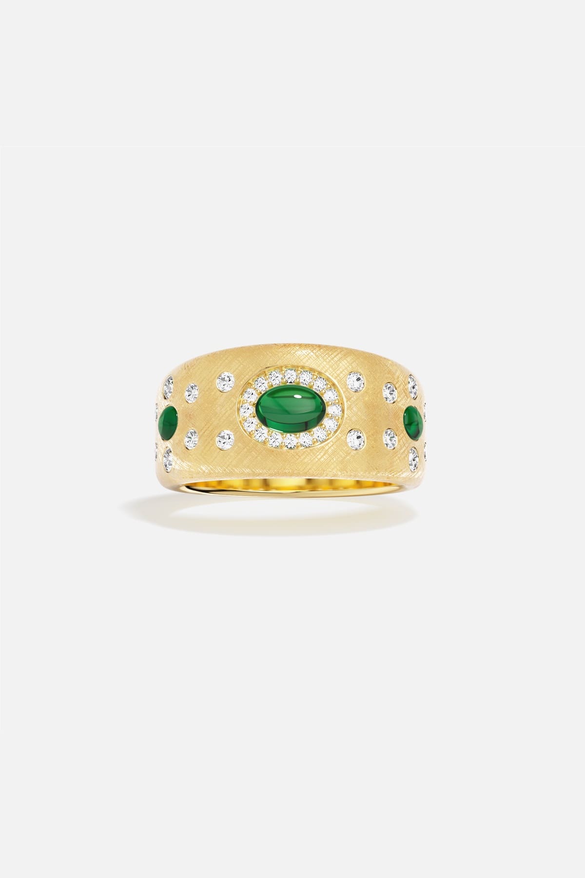 APM Ring in golden hue, brushed finish with emerald accents, quietly regal.