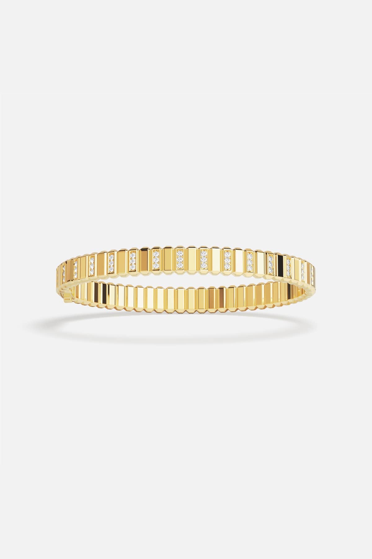 APM Monaco ribbed bangle in golden color, radiant modern elegance with a refined shimmer.