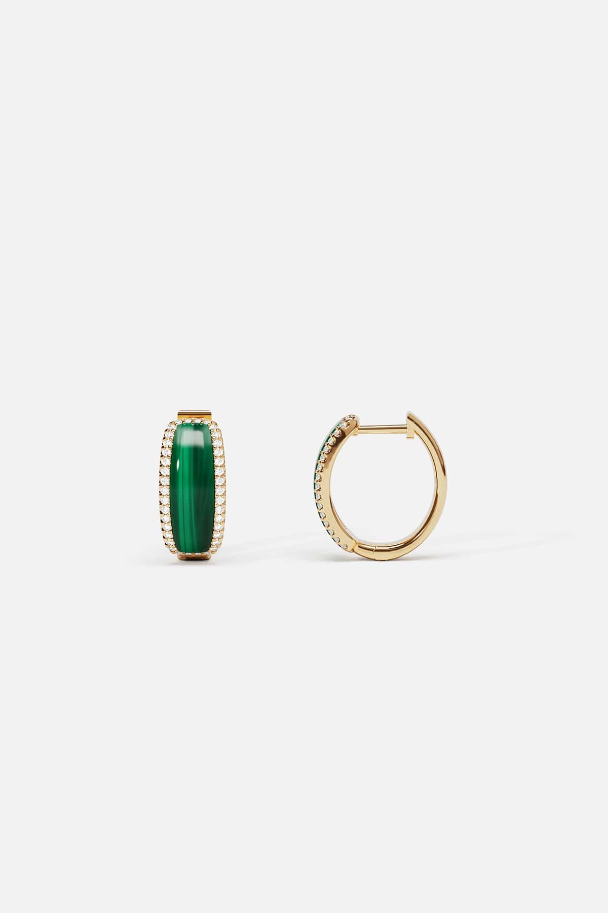 APM Monaco hoop earrings in golden hues and vivid green, quietly radiant elegance.