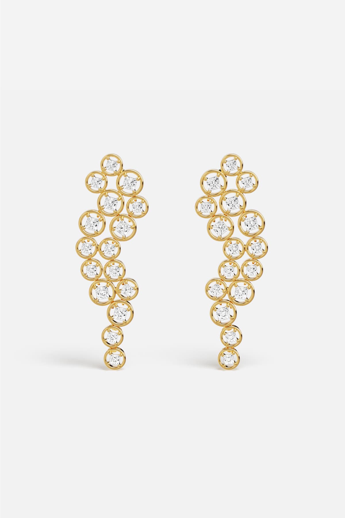 APM Earrings in golden color, a cascade of light with effortless elegance.