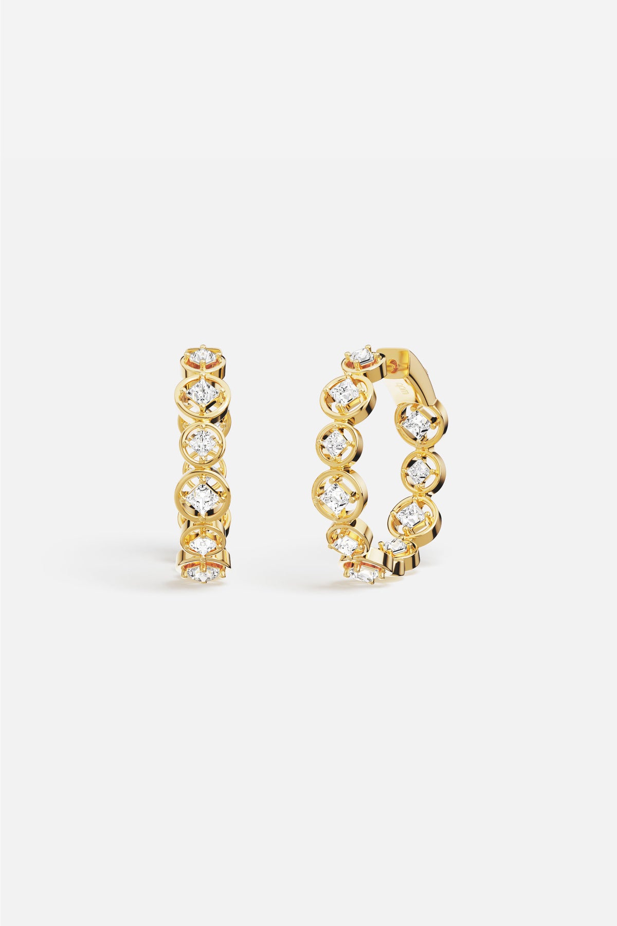 APM Hoop Earrings in golden color, a luminous rhythm of sparkle and light.