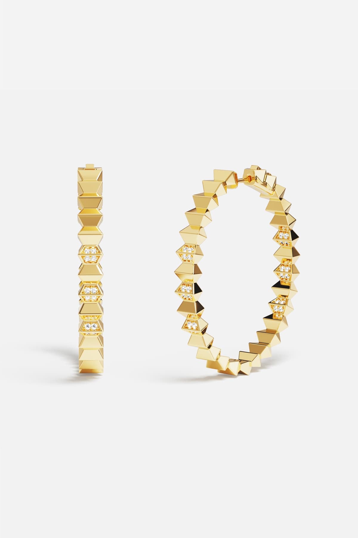 APM Hoop Earrings in gold color, bold edges meeting quiet sparkle.