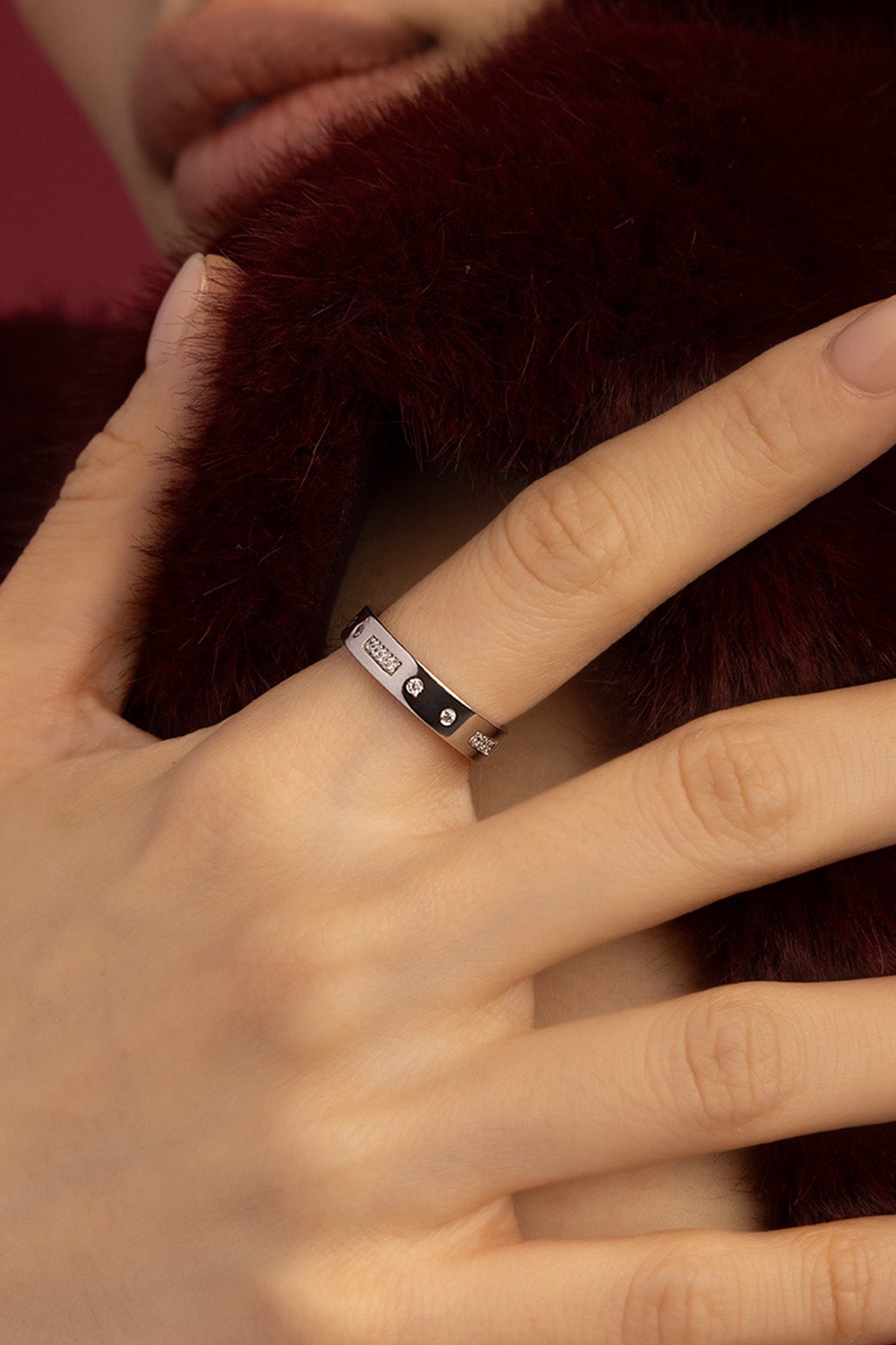 Woman wearing APM Morse Ring, a whispered code in rhodium finish elegance.