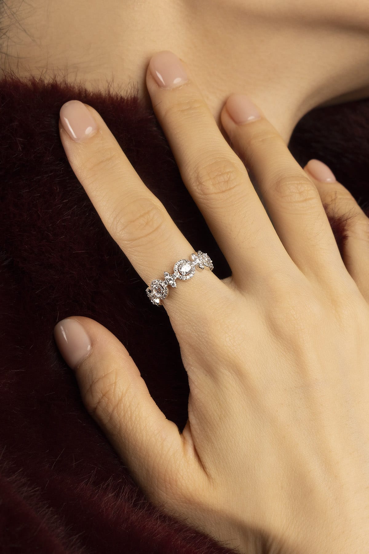 Woman wearing APM ring, a delicate sparkle of quiet winter elegance.