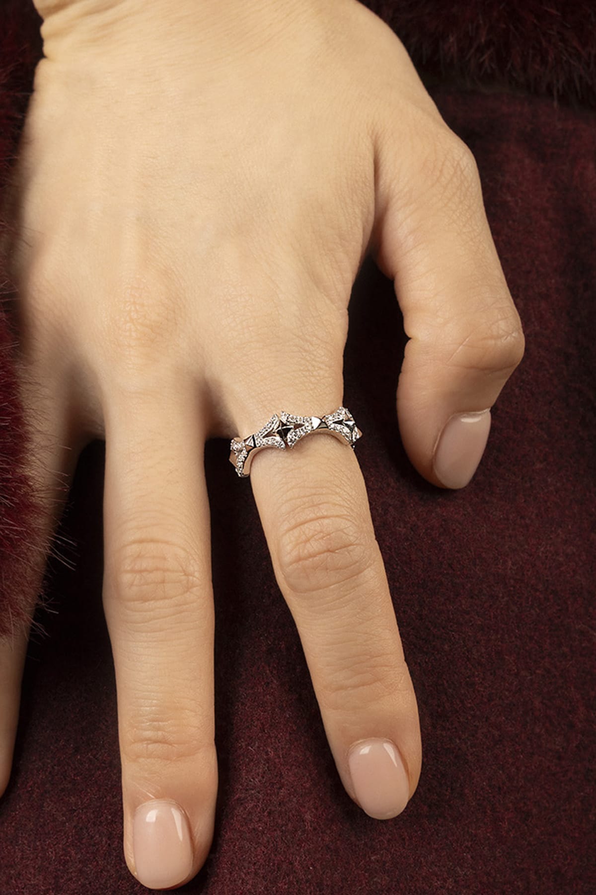 Woman wearing APM Morse Ring, a sparkling whisper of modern elegance.
