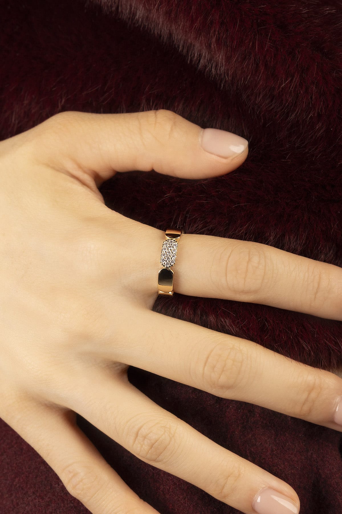 Woman wearing APM Morse Ring, a golden whisper of quiet elegance.
