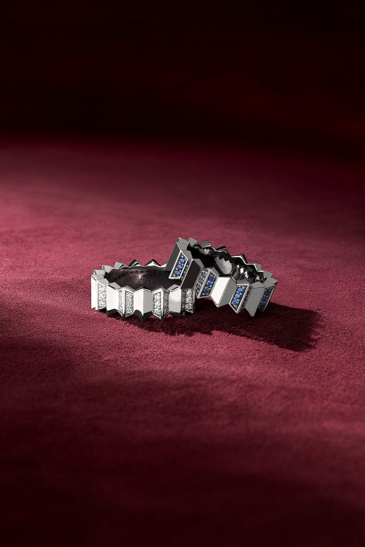 APM Rings in rhodium finish, an architectural duo whispering bold elegance on velvet.