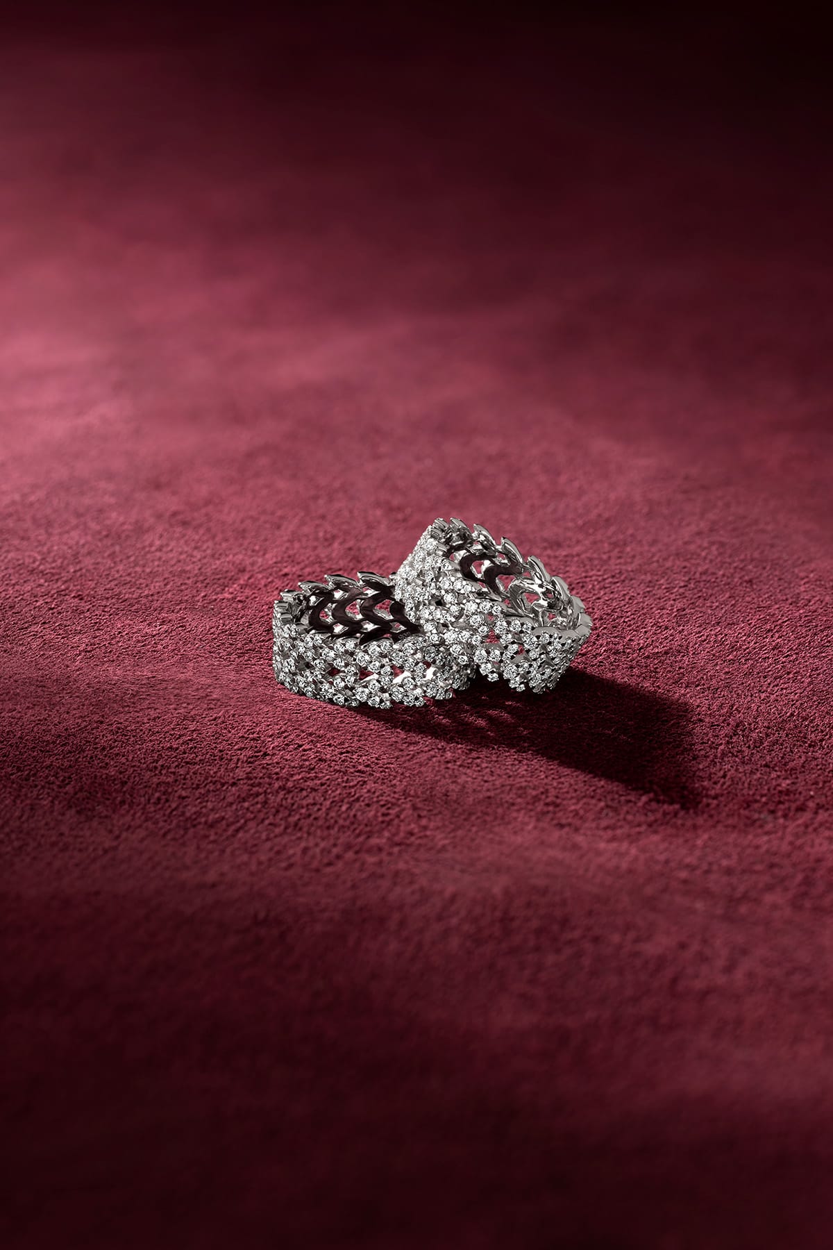 APM Monaco Rings shimmering on velvet, a whisper of bold elegance.