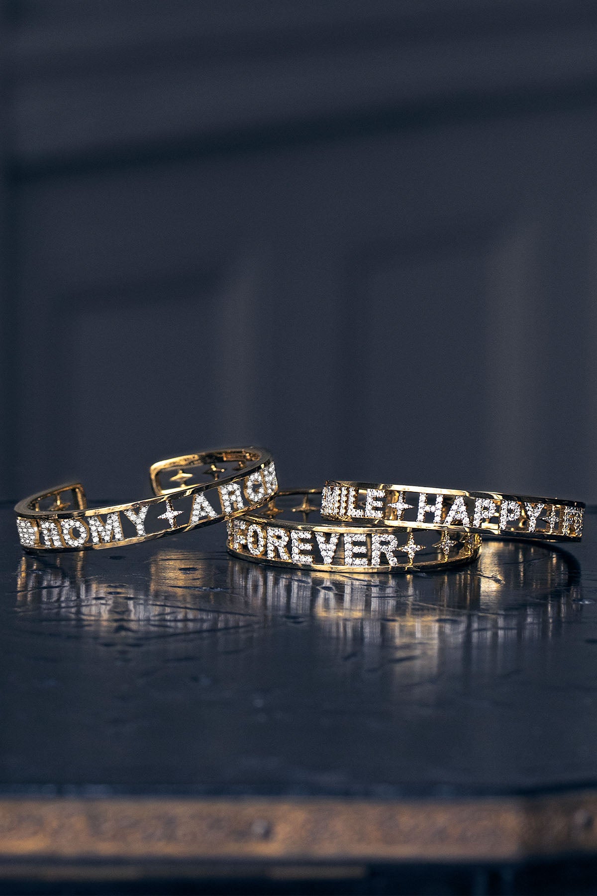 APM Bangles in golden colors, personalized words shimmering like little everyday promises.
