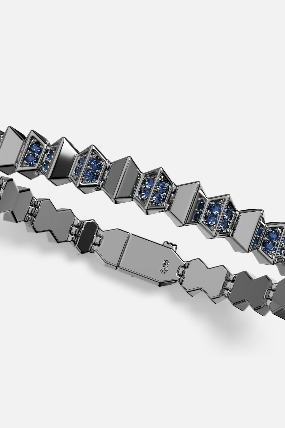 APM Bracelet in dark rhodium finish, faceted links glowing with deep blue brilliance.