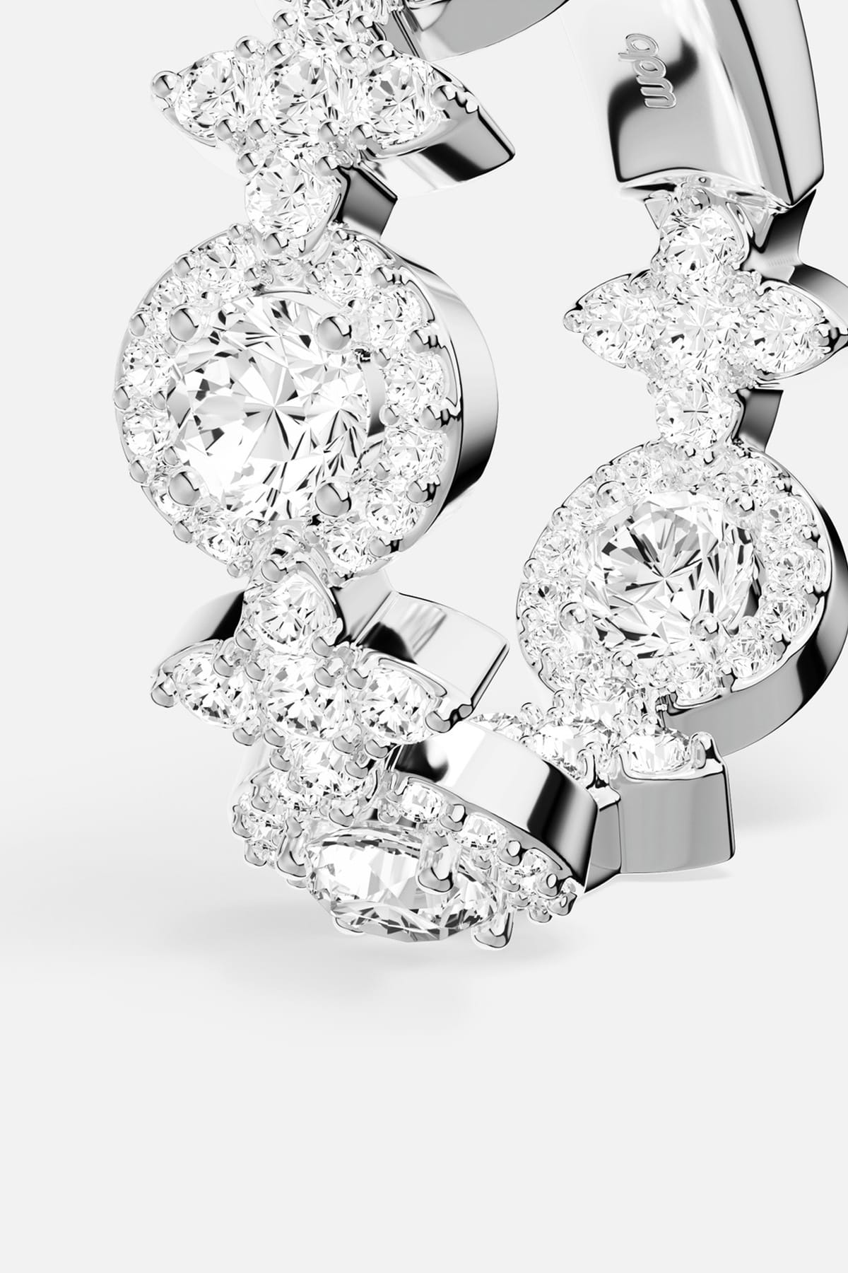 APM Ring in rhodium finish, a luminous dance of florals and radiant halos.