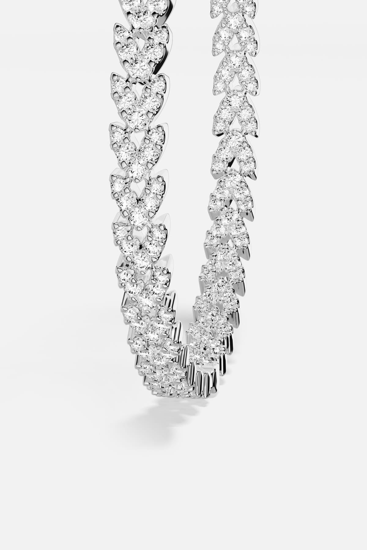 APM Necklace, a shimmering cascade of light in rhodium finish.
