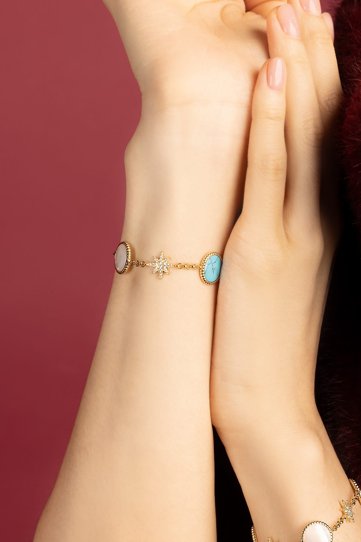 Woman wearing APM Météorites Bracelet, a celestial glow on the wrist.