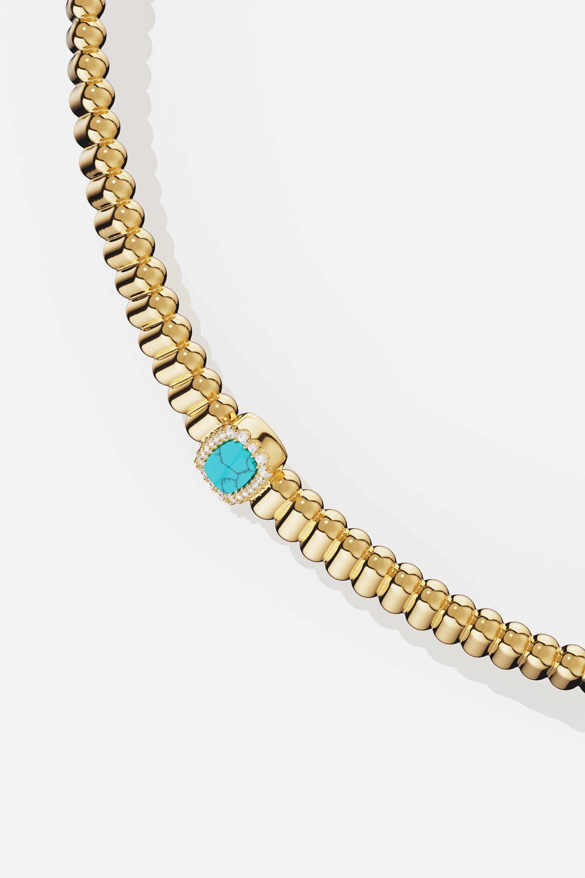 APM beaded necklace in gold color, a turquoise centerpiece whispers summer elegance.