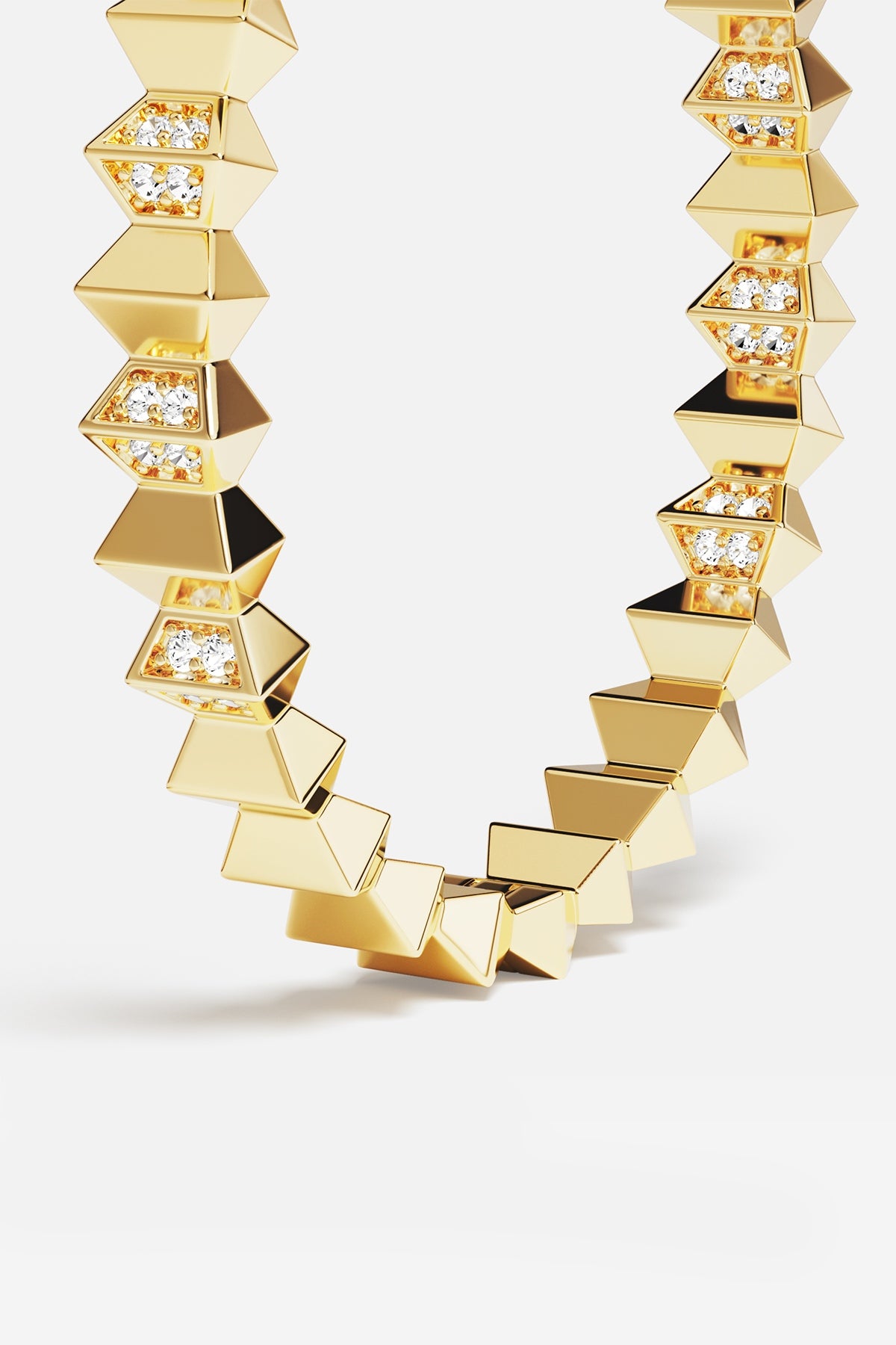 APM Necklace in golden color, bold geometric edges glowing with quiet confidence.