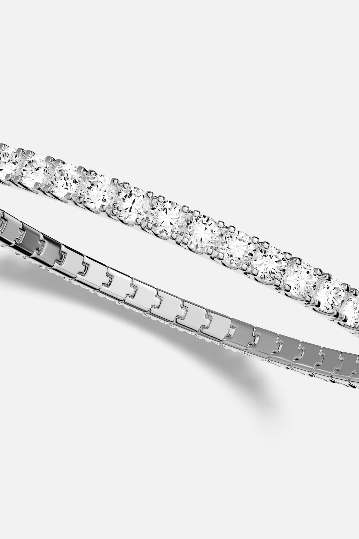 APM Tennis Bracelet, a timeless sparkle with rhodium finish elegance.