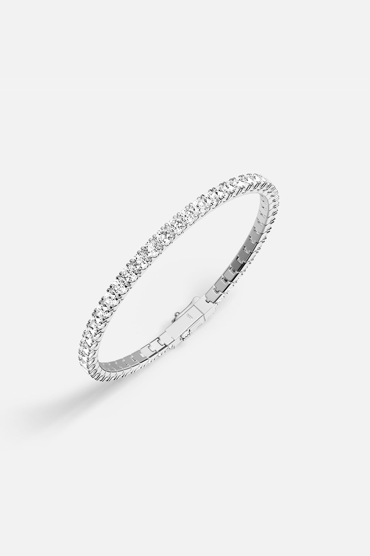 APM tennis bracelet in rhodium finish, a timeless line of quiet brilliance.