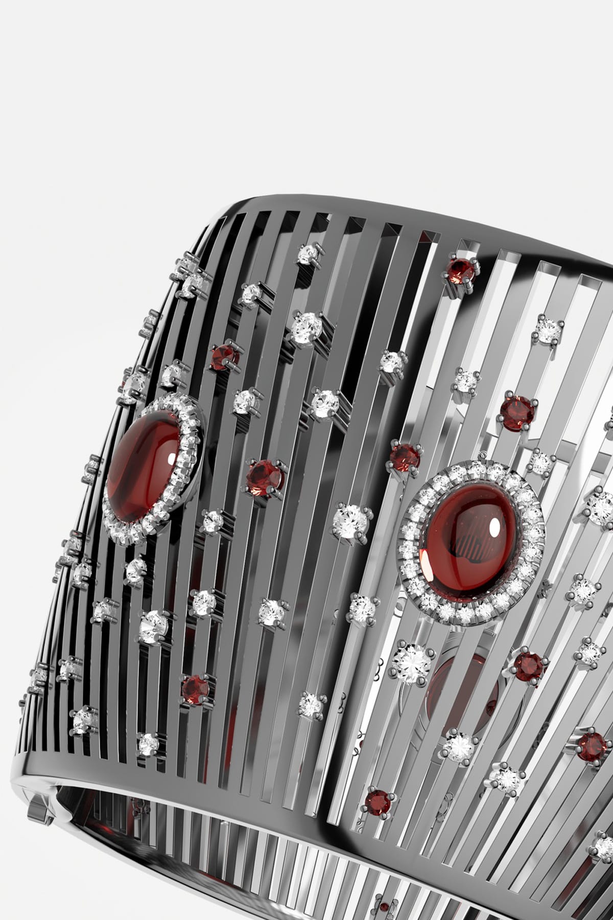 APM Monaco cuff bracelet in rhodium finish, scattered with crimson stones for bold allure.