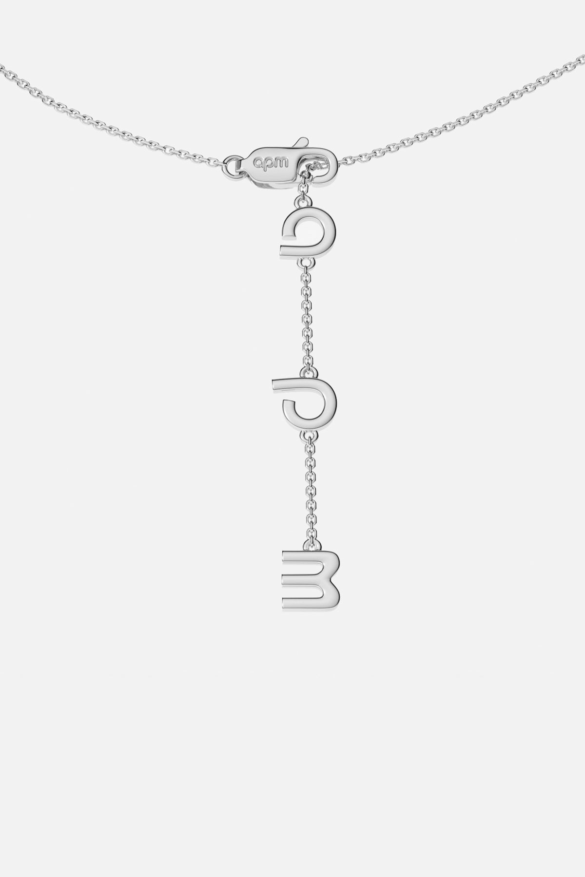 APM Necklace with cascading letters, a signature whisper in rhodium finish.