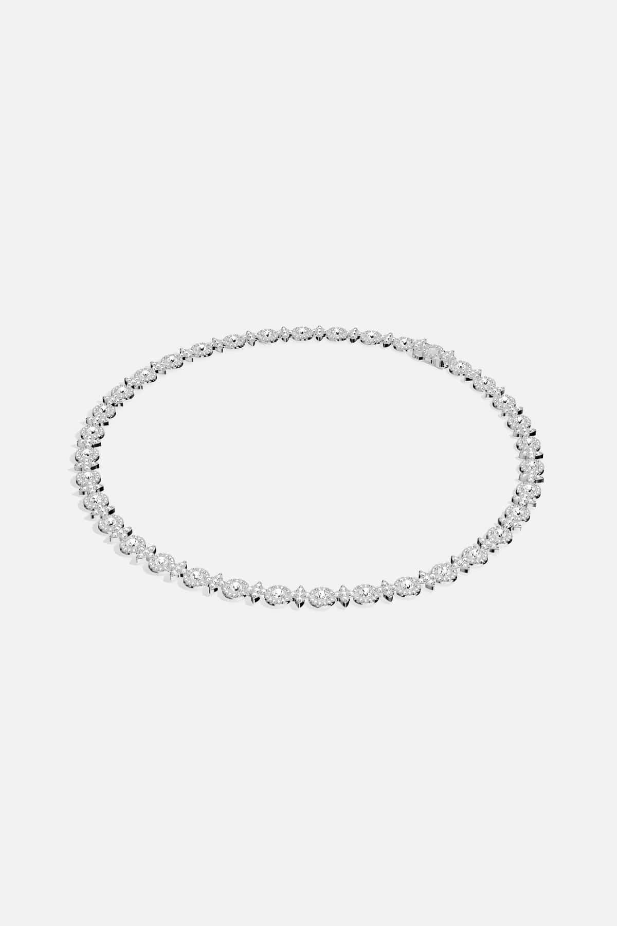 APM Necklace shimmering in rhodium finish, a luminous whisper of timeless elegance.