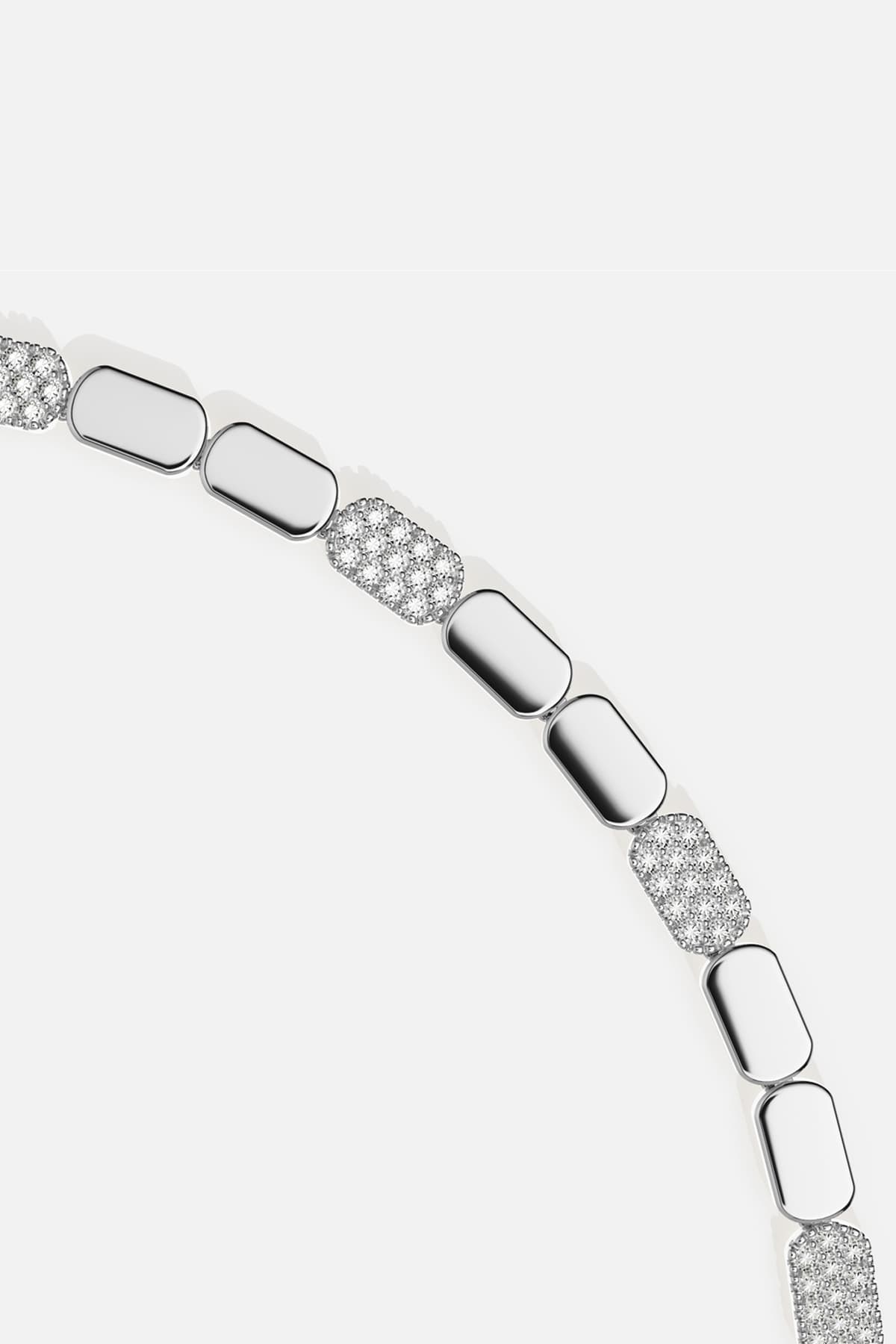 APM Bracelet in rhodium finish, sleek links glowing with modern elegance.