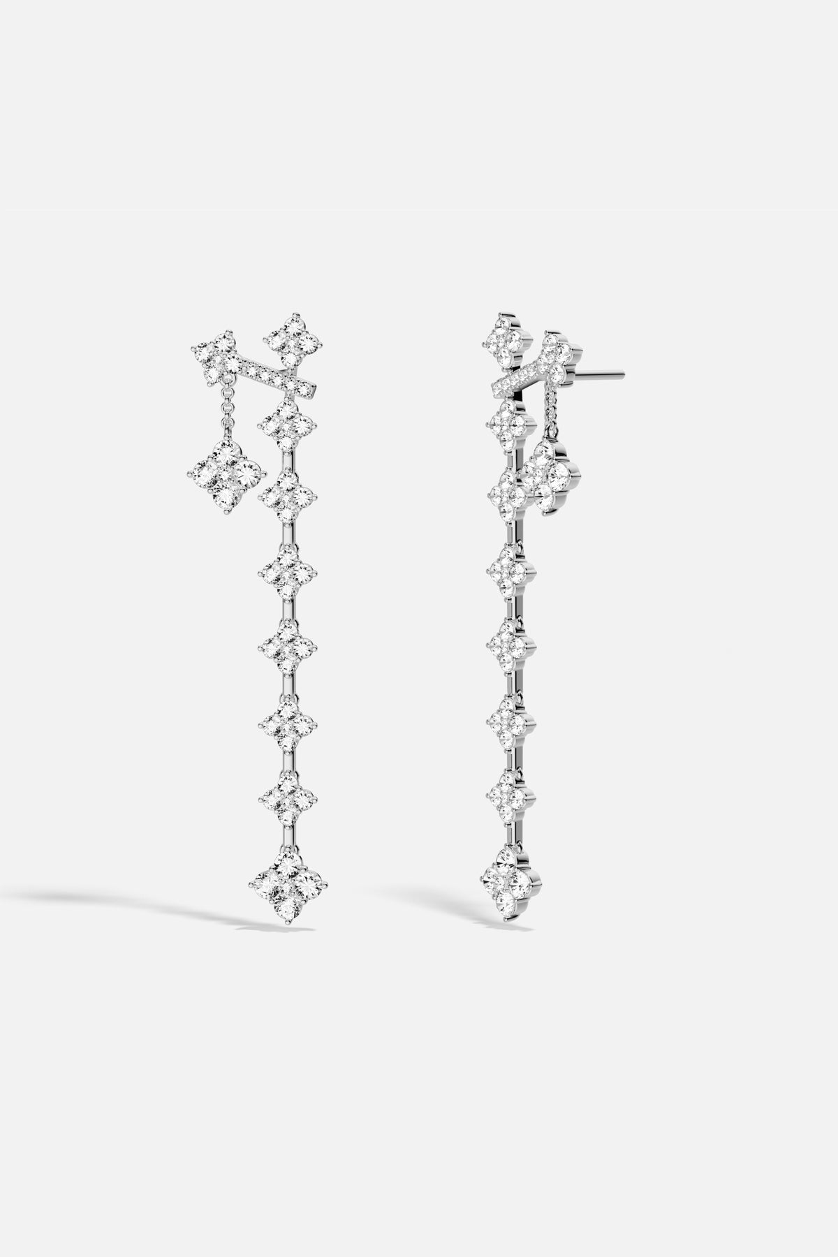 APM Monaco drop earrings, a cascade of shimmering clovers in rhodium finish.