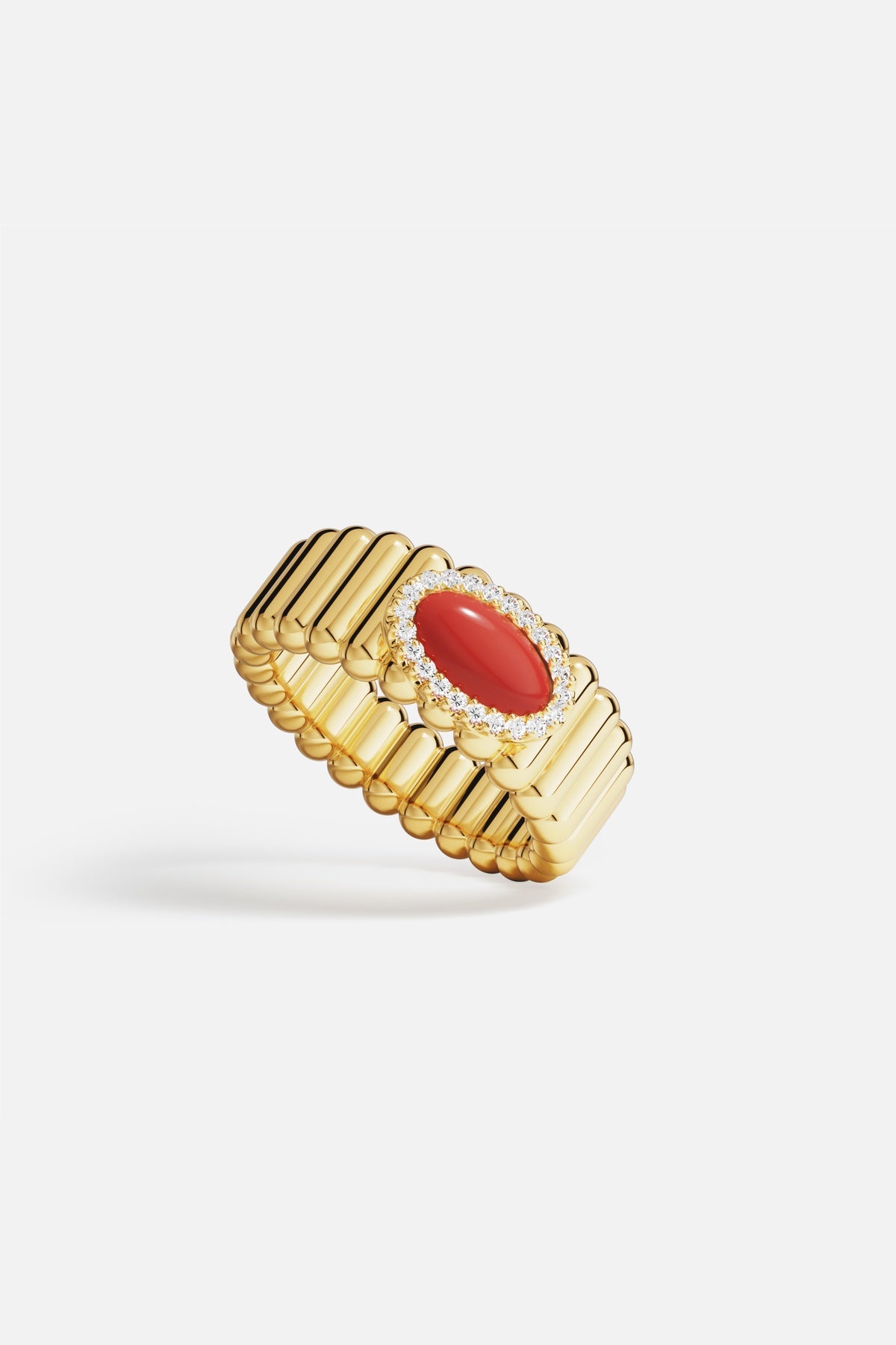 APM Ring in gold color with a bold red centerpiece, radiant elegance.