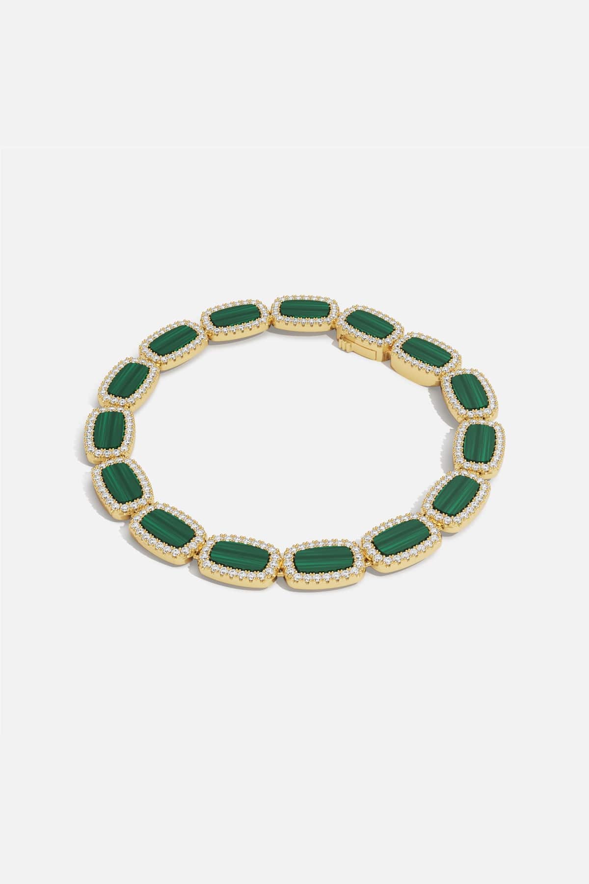 APM Monaco bracelet in gold color with green stones, radiating quiet elegance.