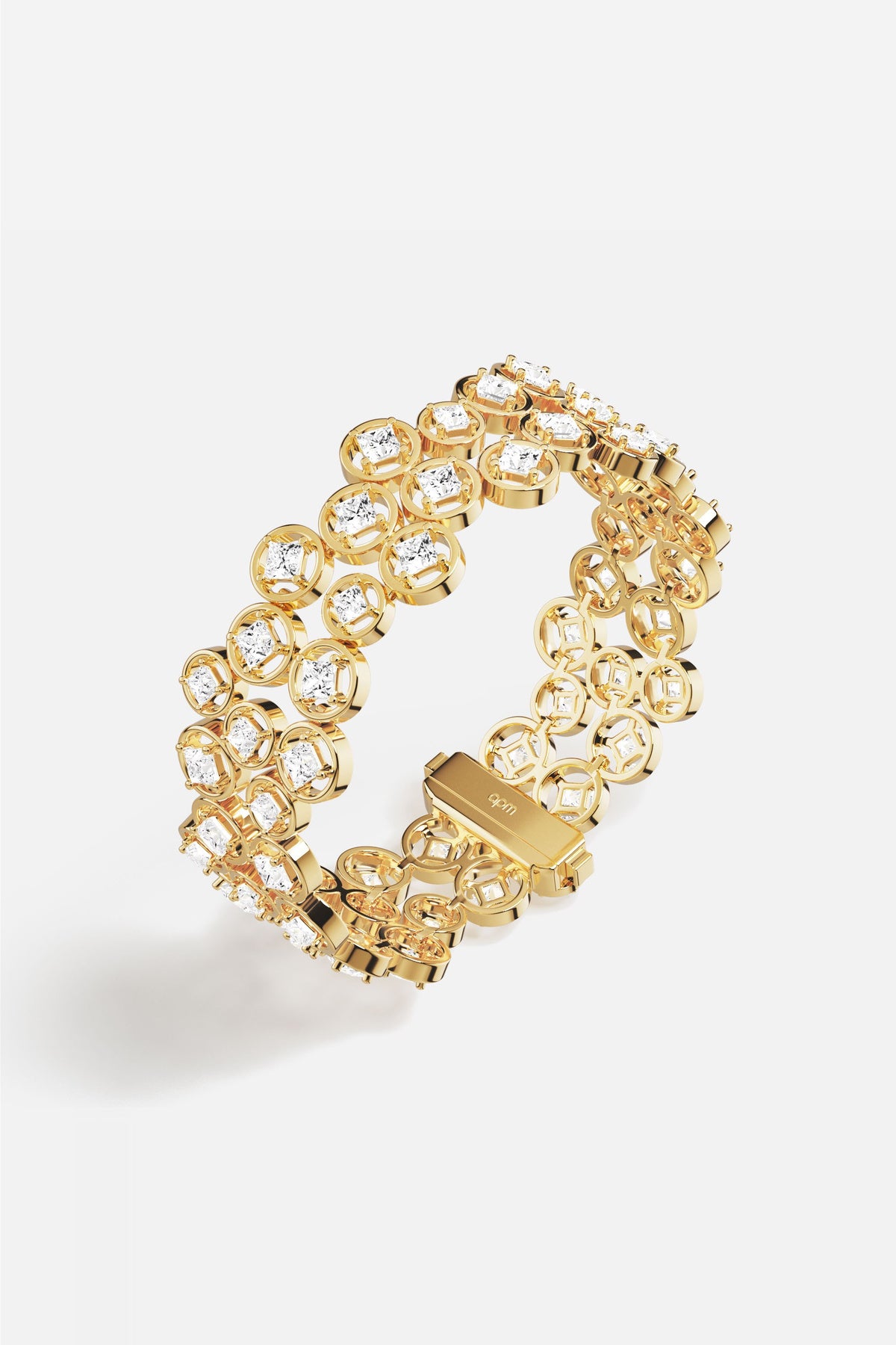 APM Monaco bracelet in golden color, radiant links shimmering with quiet confidence.