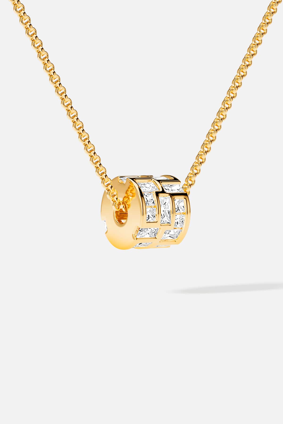 APM Necklace in golden hue, a luminous charm of modern elegance.