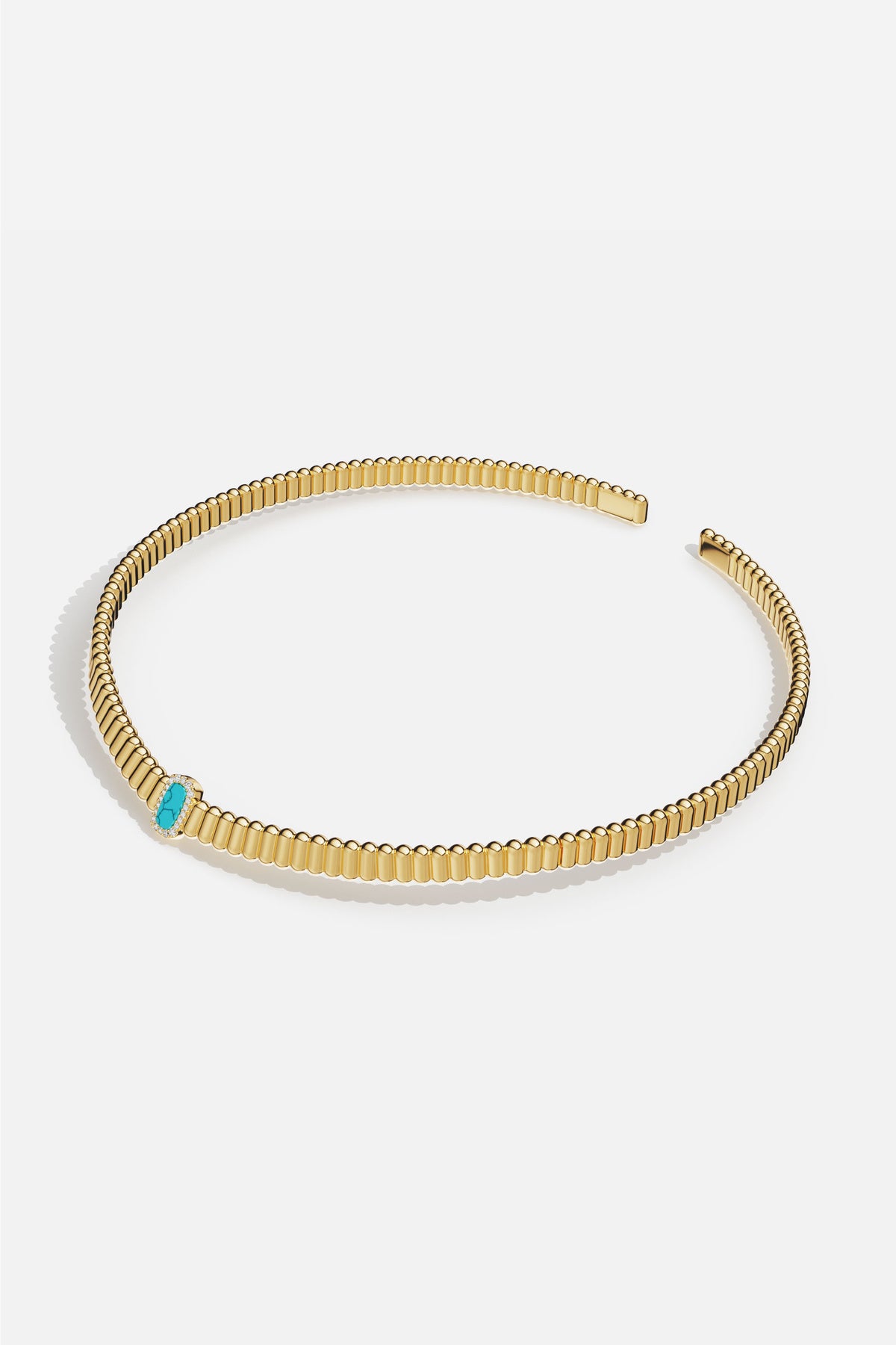 APM Necklace in golden ridges, kissed by a turquoise glow.