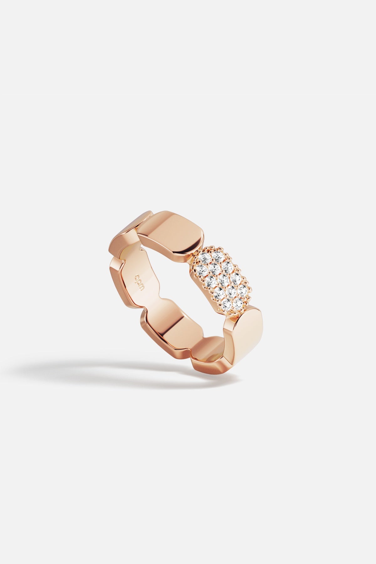 APM Ring in rose color, sculpted links meeting a soft sparkling glow.