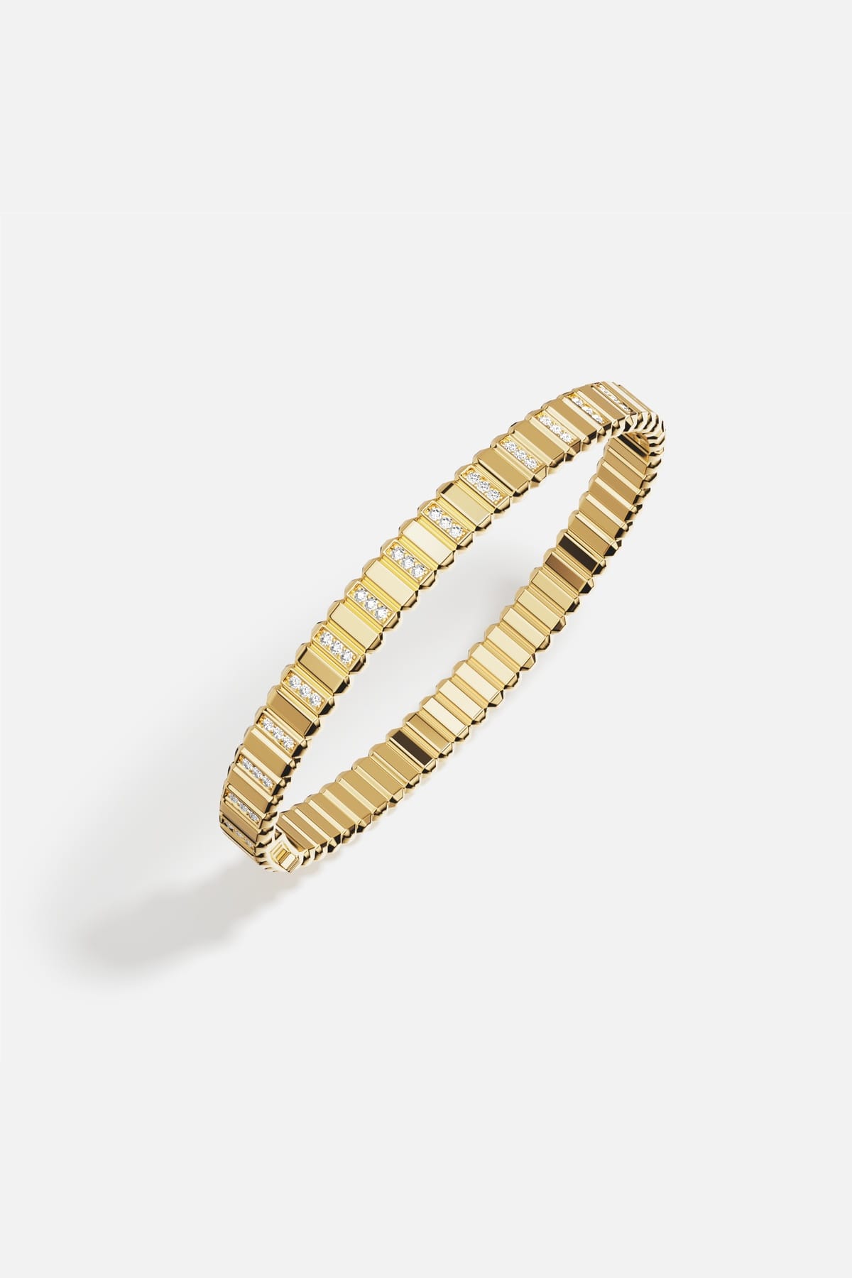 APM Bracelet in golden hues, ridged elegance meeting a subtle sparkle.