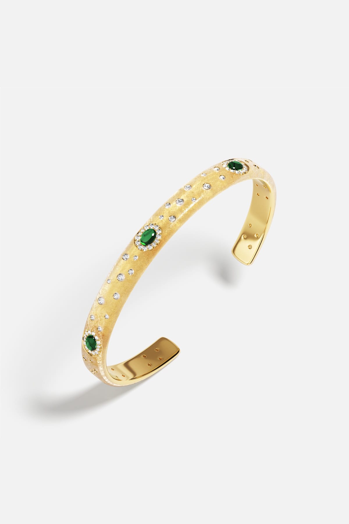 APM Cuff Bracelet in golden hue, scattered sparkle and emerald green allure.